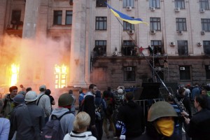 People wait to be rescued on upper storeys at the trade union building in Odessa