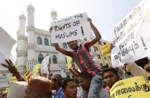Sri Lankan Muslims shout slogans and carry placards during a protest against the government in Colombo
