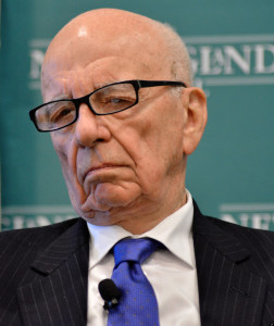News Corporation CEO Rupert Murdoch, listens to introductions during a forum on The Economics and Politics of Immigration in Boston at which Murdoch and New York Mayor Michael Bloomberg spoke, Tuesday, Aug. 14, 2012. (AP Photo/Josh Reynolds)